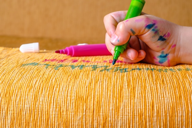 hands stitching colorful thread